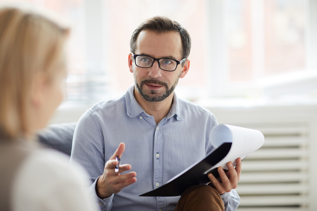 Patient speaking with counselor.